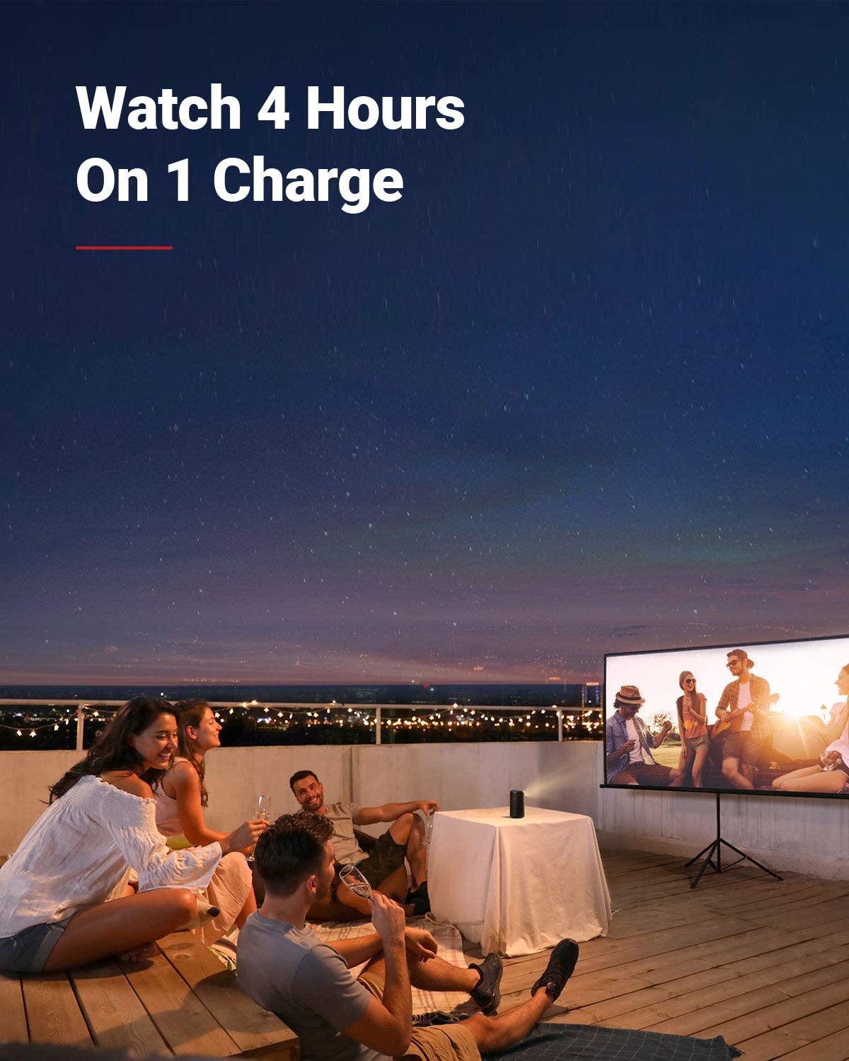 A group of friends drink wine on their rooftop at night while using a Capsule Max portable projector to watch a movie.